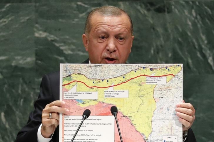 Turkeys President Recep Tayyip Erdogan holds up a map as he addresses the 74th session of the United Nations General Assembly at U.N. headquarters in New York City, New York, U.S.